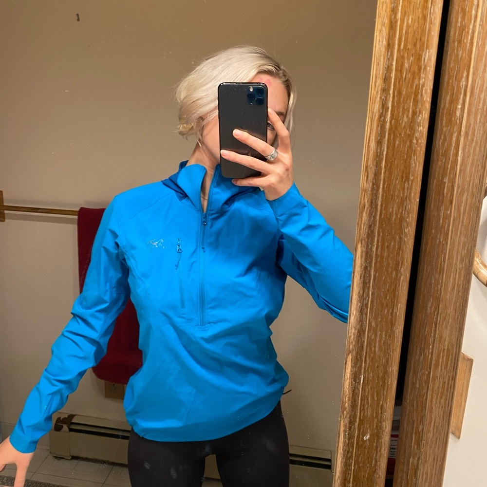 Blue Arc’teryx quarter-zip, waterproof jacket